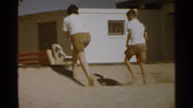 San Francisco (1959): Mom And Son Walking At The Beach Together With Their Toes In