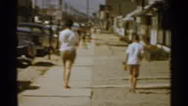 San Francisco (1959): Two People Walking Down The Boardwalk Together It Is Very