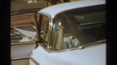 San Francisco (1959): A Caucasian Man Walks Beside A Vintage Blue Car With A Woman