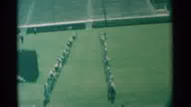South Dakota (1959): A Bunch Of People Marching In A Field In A Line Dancing Style