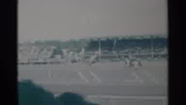 Cheyenne Wyoming-1960: Person Wearing White Shirt Rides Bronco At Rodeo On A Sunny Day