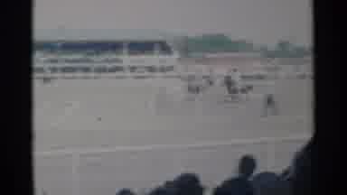 Cheyenne Wyoming (1960): People On Horseback Chasing Steer At Rodeo On A Sunny Day