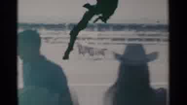 Cheyenne Wyoming (1960): A Black Spot Damages A Shot Of A People Watching A Rodeo