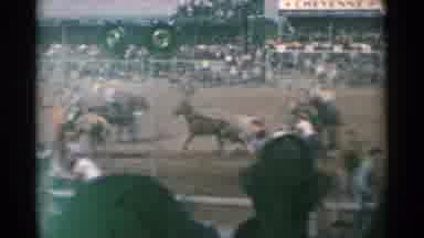 Cheyenne Wyoming (1961): Horses People Dirt Running Brown Hat Cowboys Rodeo
