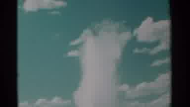 Cheyenne Wyoming (1961): Geyser Shoots Water High Into The Air Blue Sky Puffy