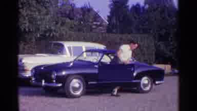 Germany (1961): Two Carl Parked And One Getting Down From Blue Car
