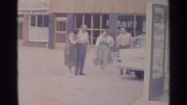 Germany (1961): Two Couples Standing Outside Of A Car In The 1950'S