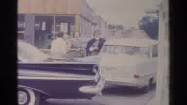 Germany (1961): Three Women Prepare To Enter A Car That Is In A Line At A Shell