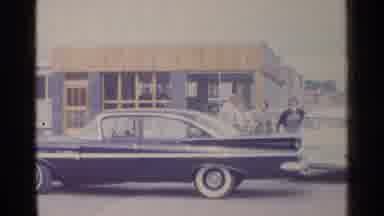 Germany (1961): Classic Car Parked In Parking Lot With People