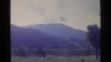 Germany (1961): Hand Held Footage Of Two Mountains Followed By A Large Cloud