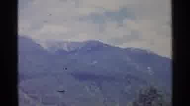 Germany (1961): Mountains In The Sky Half Covered By Trees And Half By Snow