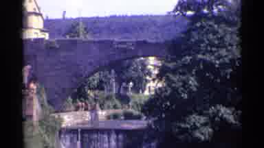 Germany (1961): The Stone Bridge Looks Old But It Still Stands Strong As People