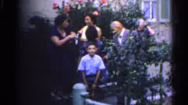 Germany (1961): Family Standing Outside Next To A Tree Getting Ready To Take A
