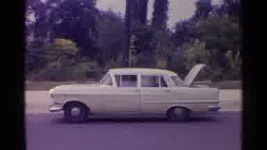 Paris France (1961): White Car With Open Trunk On A Clear Day