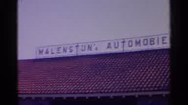 Paris France (1961): Sweeping The Roof Of An European Car Dealership Then A Women