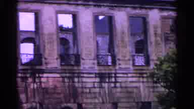 SWITZERLAND-1961: Vintage 8mm Film of a Weathered Building with Ornate Balconies