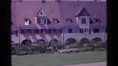 Switzerland (1961): Little Girls In Red Sweaters Run Around The Yard Of The Huge