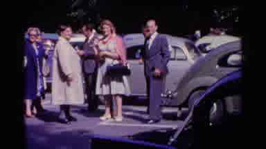 Switzerland (1961): Parking Lot Gathering Before Heading Into An Event On Sunday
