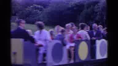 SWITZERLAND-1961: Family Riding Amusement Park Train Then Walking By Fountain