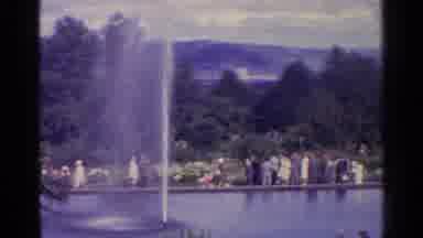Switzerland (1961): Park Scene And People Walking Leisurely Around Fountain