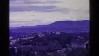 Switzerland (1961): Camera Panning An Old Neighborhood Surrounded By Mountains