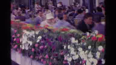 SWITZERLAND-1961: Crowd Gathering Under Covered Pavilion With Flower Planter