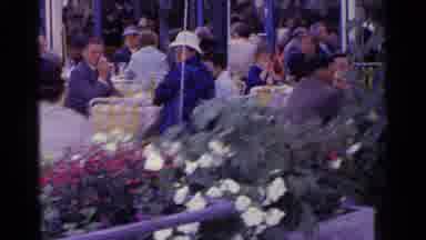 Switzerland (1961): People Sitting Outside At Tables With Pretty Flowers And