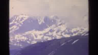 Switzerland (1961): A Scene Of A Bunch Of Very Tall Snowy Mountains Off In The