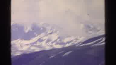 SWITZERLAND-1961: Big Mountains Covered In Snow With Beautiful Sky