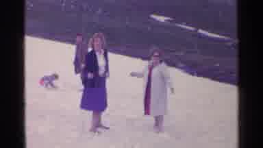 SWITZERLAND-1961: Family Enjoying Winter Holiday In Snowy Mountainside