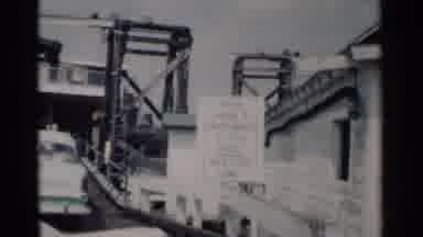 Jamestown Virginia (1962): Cars Crossing One Bridge And One Boat
