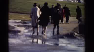 Washington DC (1962): People Walking Down A Road Towards A Tall Building During