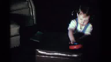 Kentucky USA (1963): Toddler In Overalls Throwing Toy Toddler Falling To Ground In