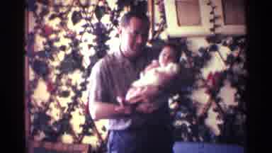 Kentucky USA (1963): A Man And A Woman Take Turns Holding A Baby Infant And Their