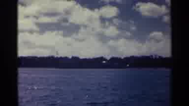 Nassau Bahamas (1963): A Giant Body Of Water Flowing Next To A Large Building That