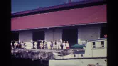 Nassau Bahamas (1963): A Whole Bunch Of People Walking Through A Marina On A