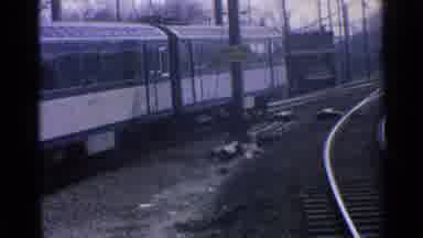 Ohio USA (1965): Train Driving Down The Railroad Tracks During The Day
