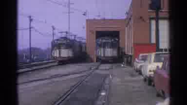 Ohio USA (1965): Cars And Trains And Bridges In A Town With Light Posts