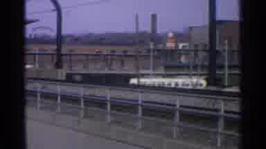 Ohio USA (1965): A Train Passing Over A Bridge Over The Urban City