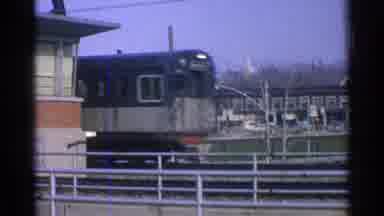 Ohio USA (1965): Old Train Station With Train And Lots Of Parked Cars
