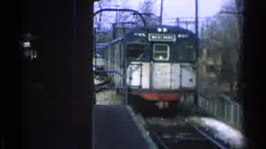 Ohio USA (1965): A Train Slowly Running Up To The Station Getting Ready To Stop