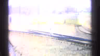 Ohio USA (1965): Yellow Train Making Its Way Through Rural Countryside