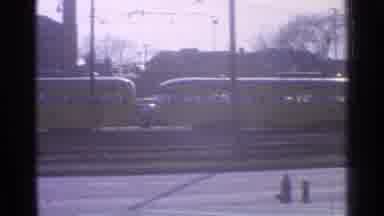 Ohio USA (1965): Train With Yellow Train Cars Moving Through An Industrial Part Of