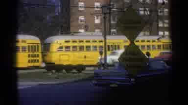 Ohio USA (1965): Yellow Commuter Light Rail Passing Through Suburbs In Middle
