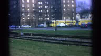 Ohio USA (1965): Two Car Yellow Train Moving Along Curved Tracks In Ohio USA