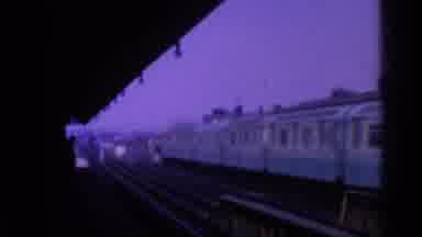 Ohio USA (1965): Blue Train Traveling Along Tracks In A City
