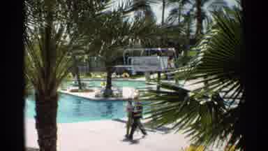 Scottsdale Arizona (1968): White collar Couple Strolling Near Pool Lifeguard