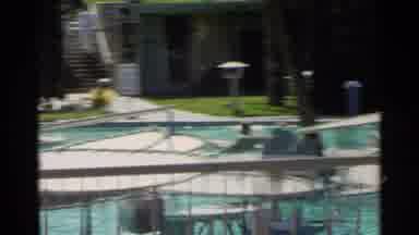 Scottsdale Arizona (1968): A Pool With Red Table clothed Tables Poolside And A