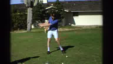 Scottsdale Arizona (1968): A Man In Sunglasses Hits A Golf Ball Near A House On A