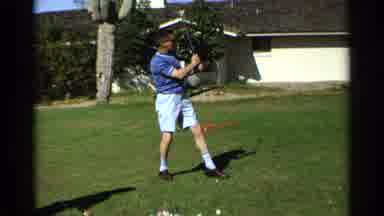 Scottsdale Arizona (1968): Man And Woman Taking Golf Swing Watching Drive On Grass
